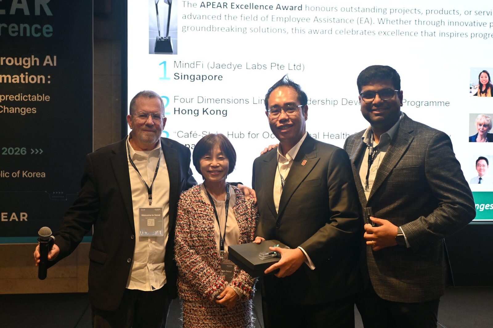 Leon CK Leong and Gangeshwar Krishnamurthy receive the EA innovations award from APEAR President Dr. Kaoru Ichikawa and Board Member David Levine in Seoul